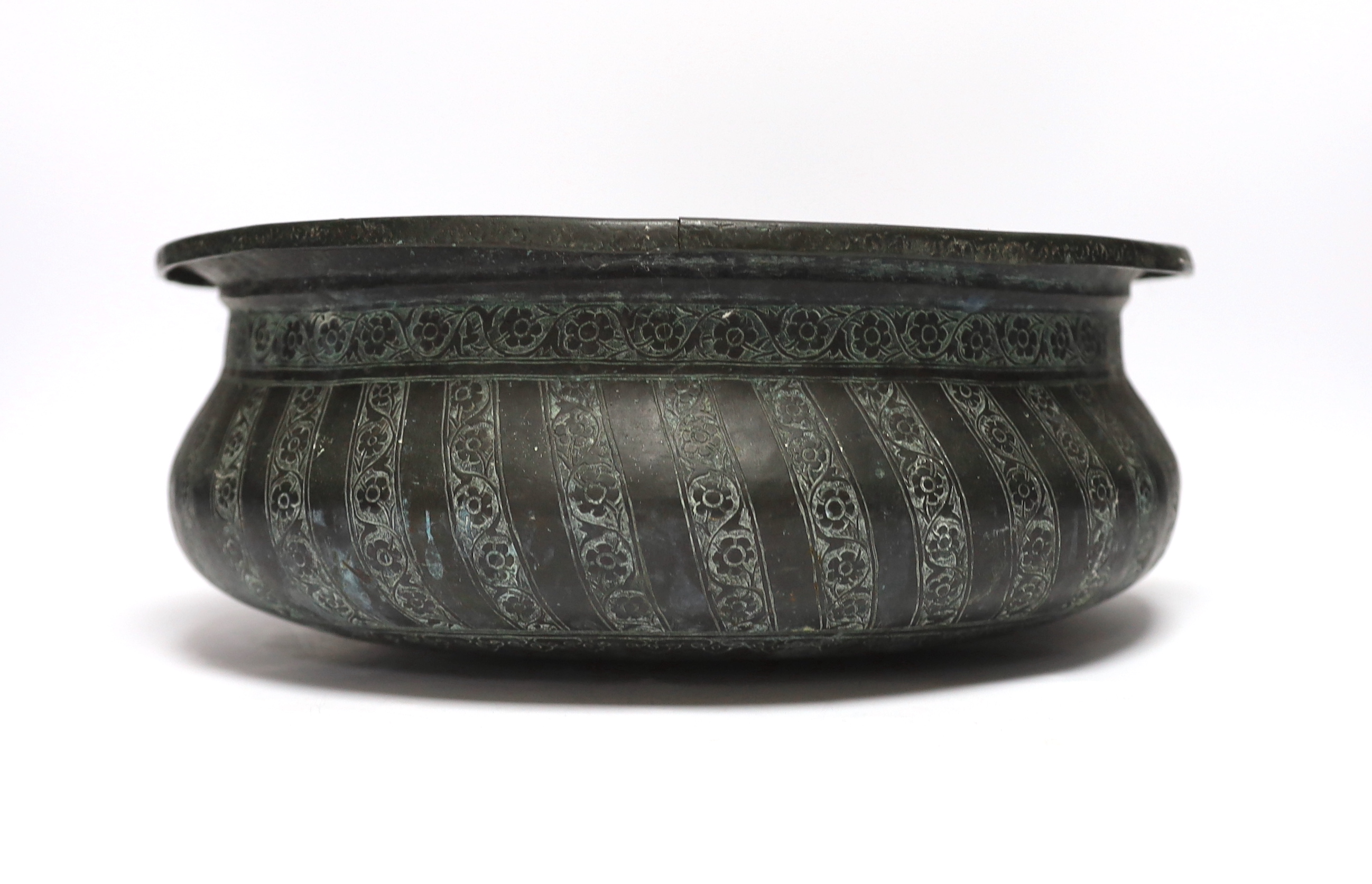 A Middle Eastern patinated copper bowl, 32cm diameter